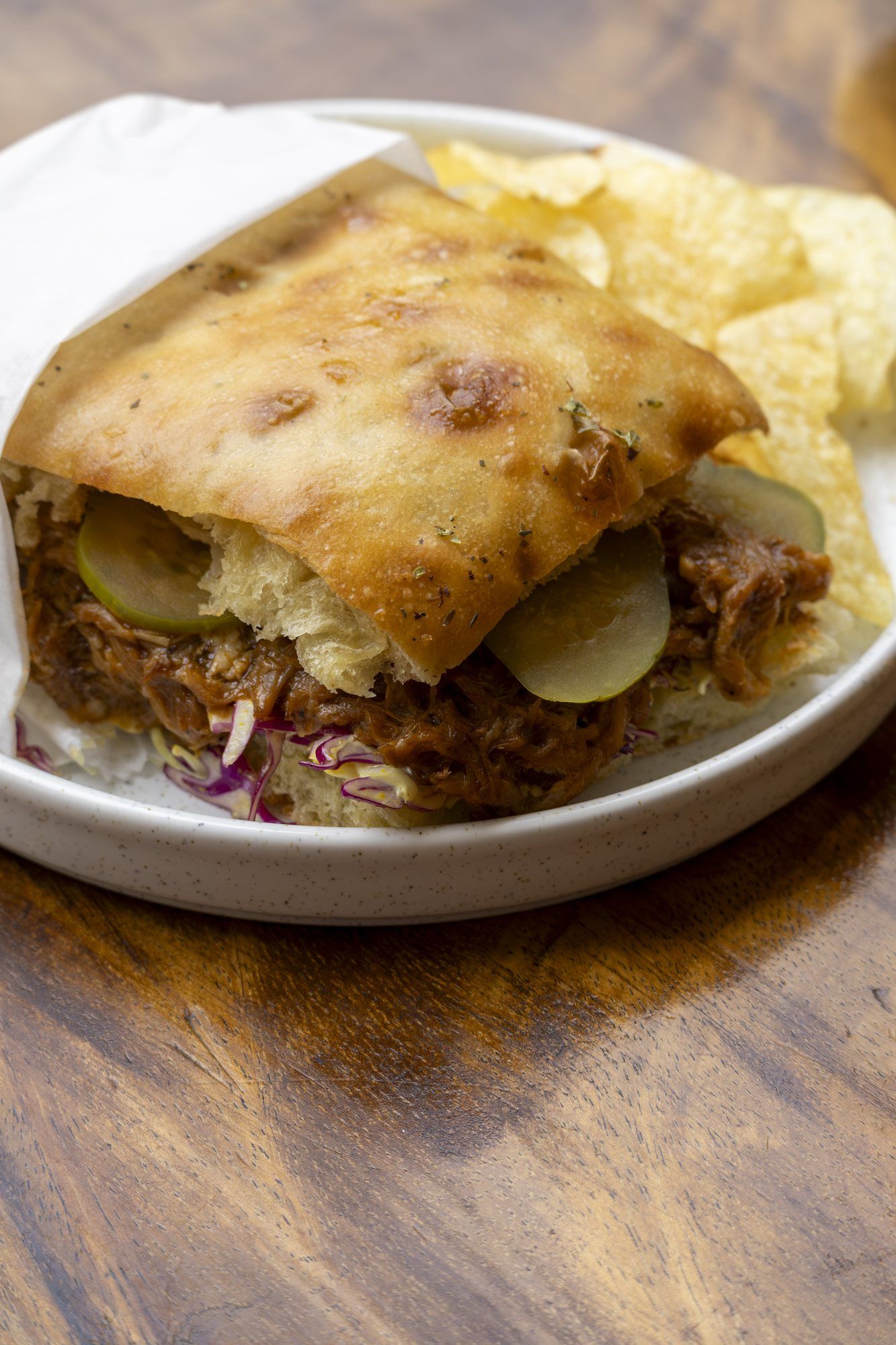 Focaccia sandwich with melted filling and chips