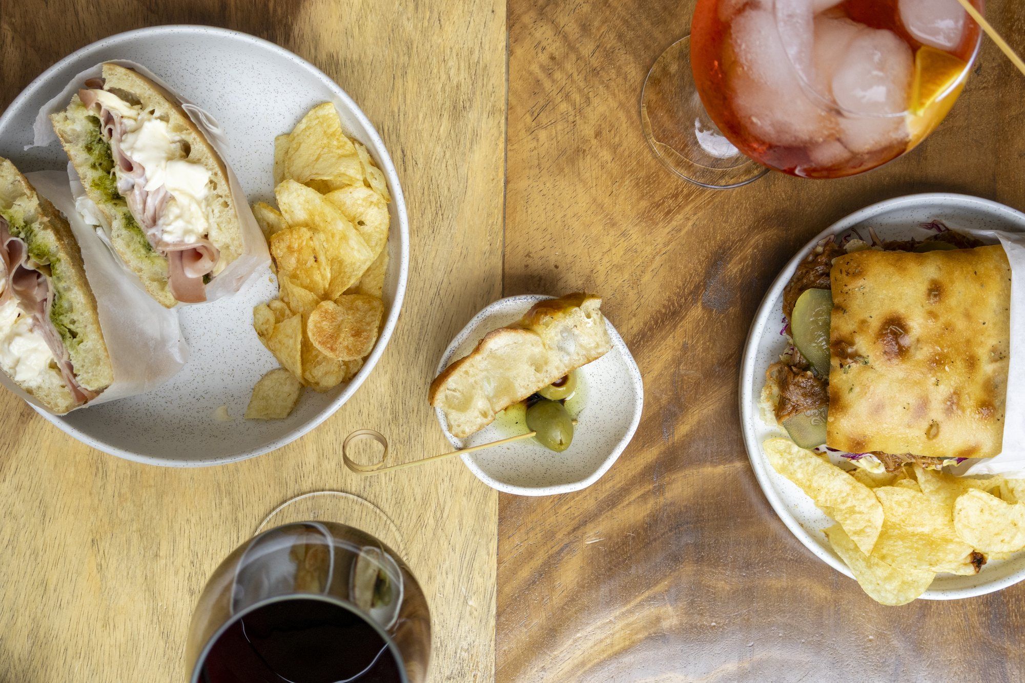 Table from above with focaccia, chips and drinks